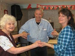 Staff and elderly clients at a social gathering