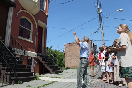 Staff giving a tour of a renovated apartment building